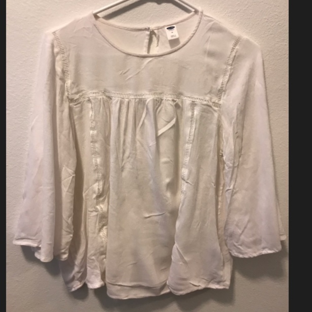 White blouse with flared sleeves